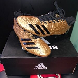 Adizero 5-Star 6.0 black and gold football cleats